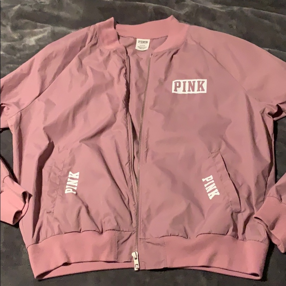 A light purple/pink windbreaker jacket